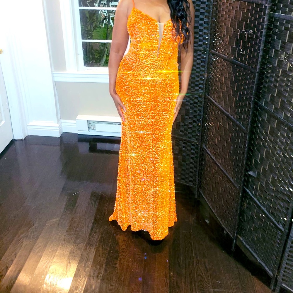 Orange Sequin Gown. Only worn once.Beautiful fitted gown.